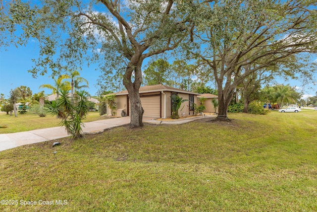 ranch-style house featuring a front lawn and a garage