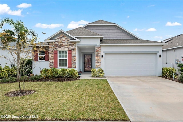 view of front of home featuring a front yard and a garage