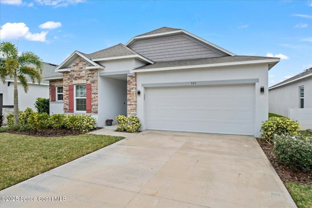 view of front of house featuring a front yard and a garage