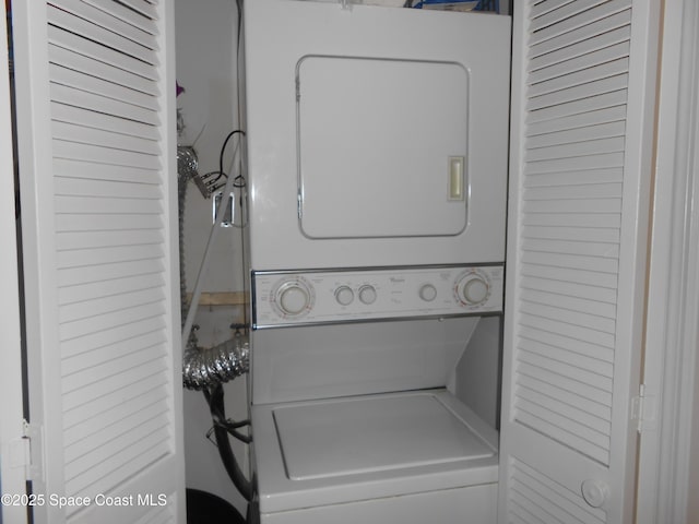 laundry room featuring stacked washing maching and dryer