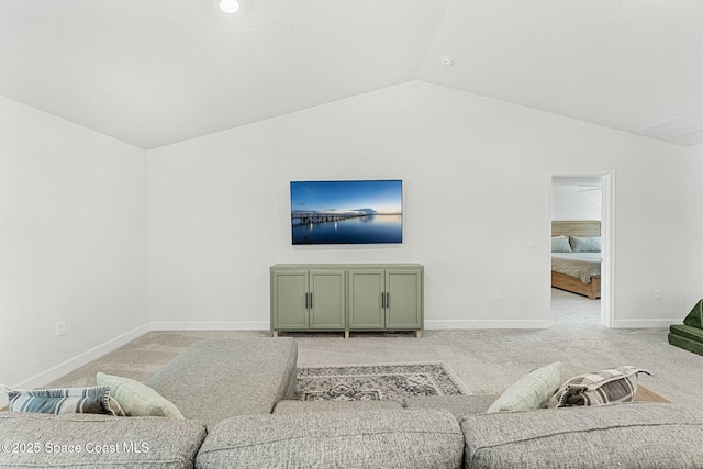 living room featuring light colored carpet and vaulted ceiling