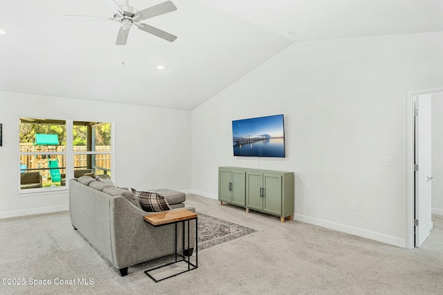 living room with ceiling fan, lofted ceiling, and light carpet