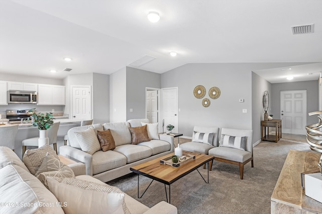 living room featuring lofted ceiling and light colored carpet