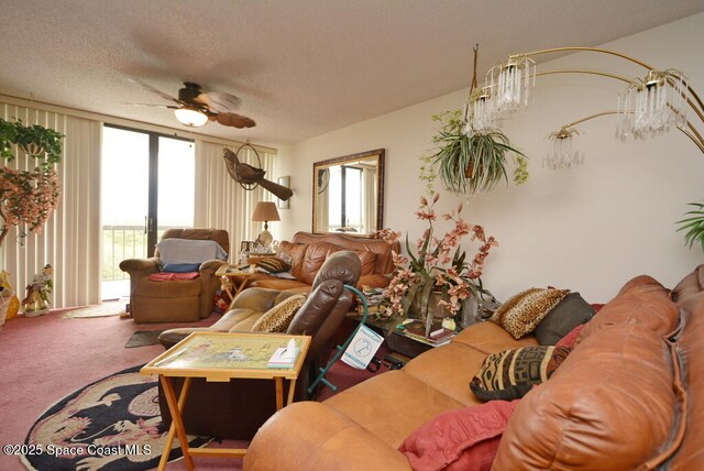 300 Columbia Dr Unit 5051, Cape Canaveral, FL 32920 - living room featuring ceiling fan, carpet flooring, and a textured ceiling