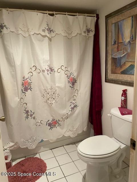 300 Columbia Dr Unit 5051, Cape Canaveral, FL 32920 - bathroom with tile patterned floors, toilet, and shower / tub combo