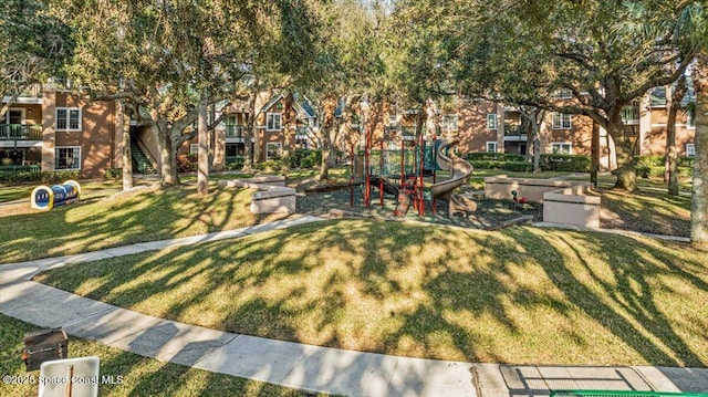 view of community featuring a yard and a playground