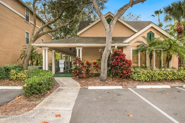 exterior space with a carport