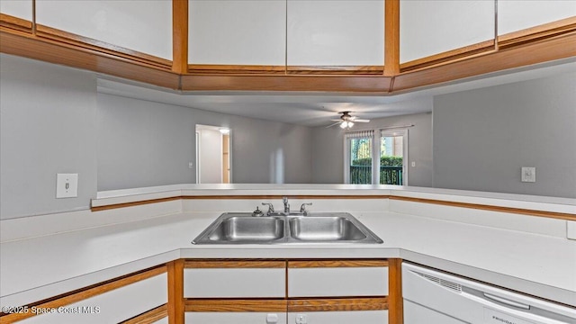 kitchen with ceiling fan, sink, white cabinetry, and white dishwasher