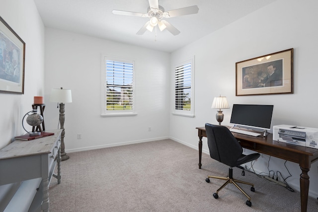 office space featuring light colored carpet and ceiling fan