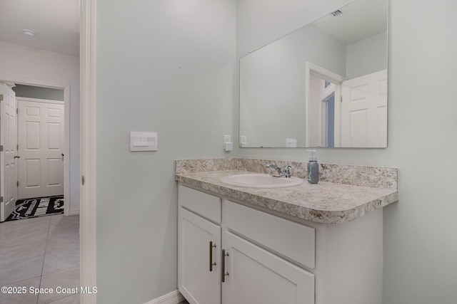 bathroom featuring vanity and tile patterned flooring