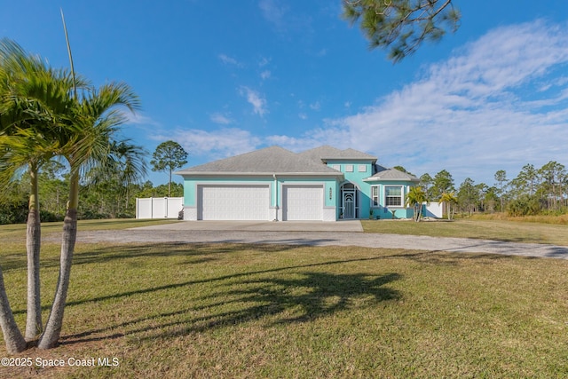 view of front facade featuring a garage and a front yard