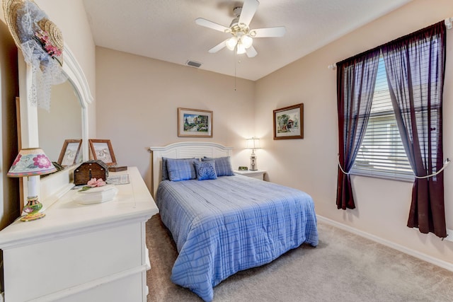 carpeted bedroom featuring ceiling fan