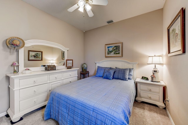 bedroom with ceiling fan and light colored carpet