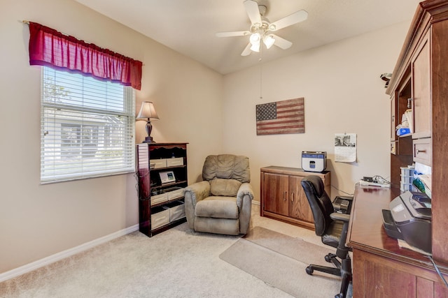 carpeted home office with ceiling fan