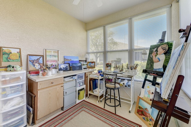 kitchen featuring ceiling fan, a healthy amount of sunlight, and light brown cabinets