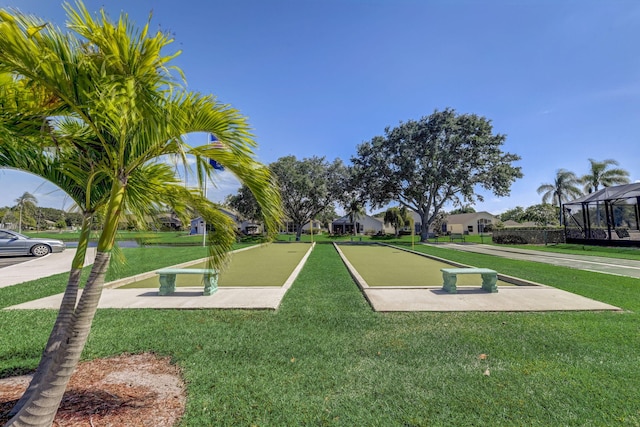 view of property's community featuring a yard