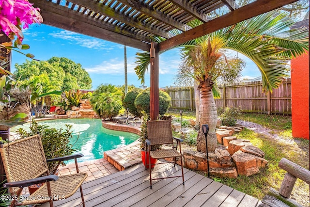 view of pool with a wooden deck and a pergola