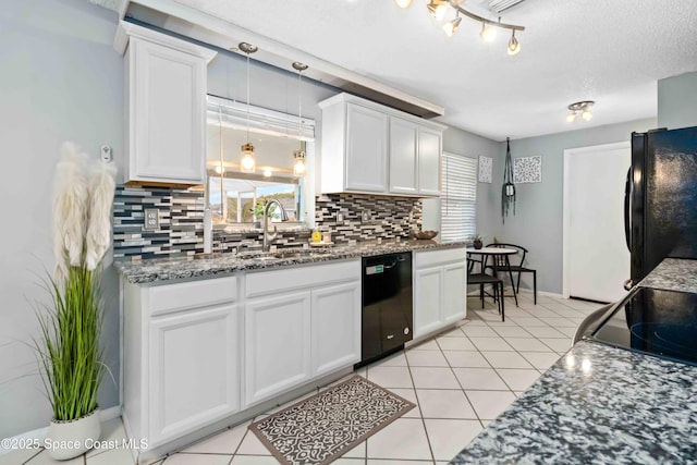 kitchen with sink, backsplash, white cabinets, and black appliances