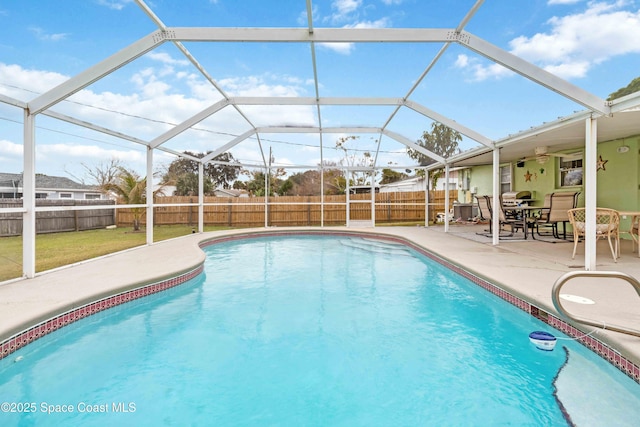 view of swimming pool with glass enclosure, a yard, and a patio