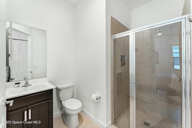 bathroom with toilet, walk in shower, and vanity