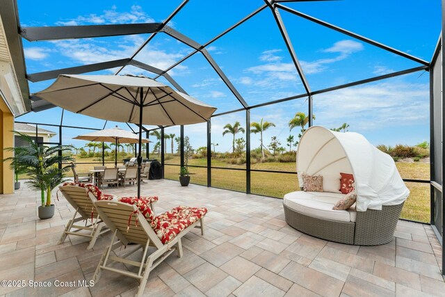 view of patio featuring a lanai