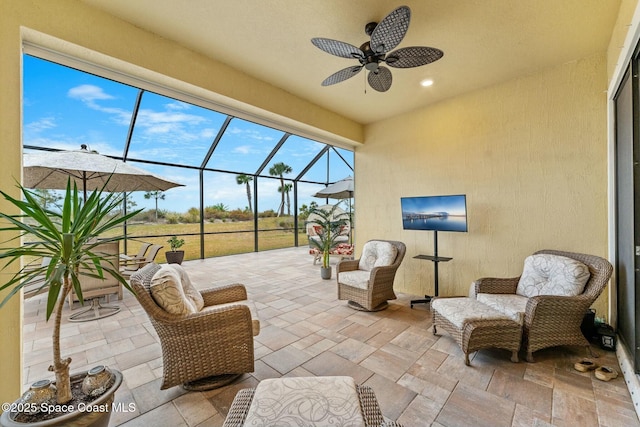 view of patio / terrace with a lanai and ceiling fan