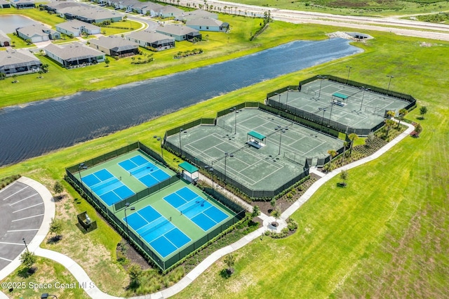 birds eye view of property featuring a water view