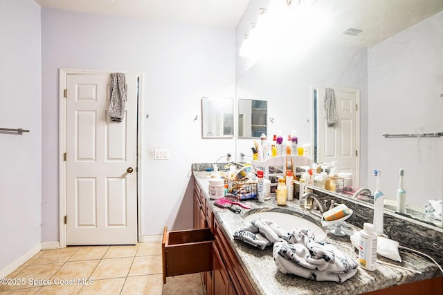 bathroom with tile patterned floors and vanity