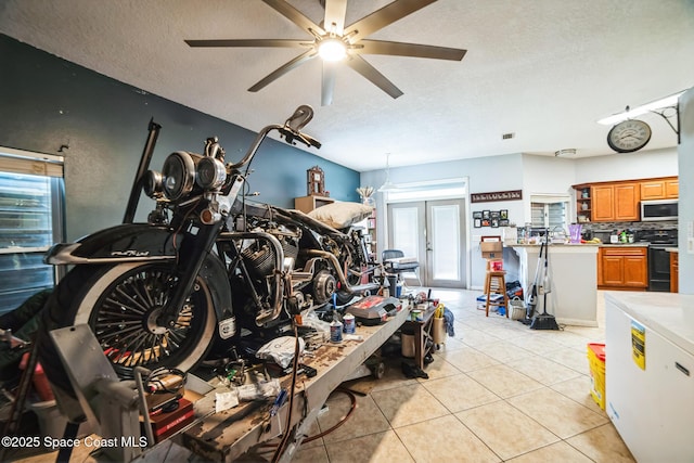 garage featuring ceiling fan and fridge