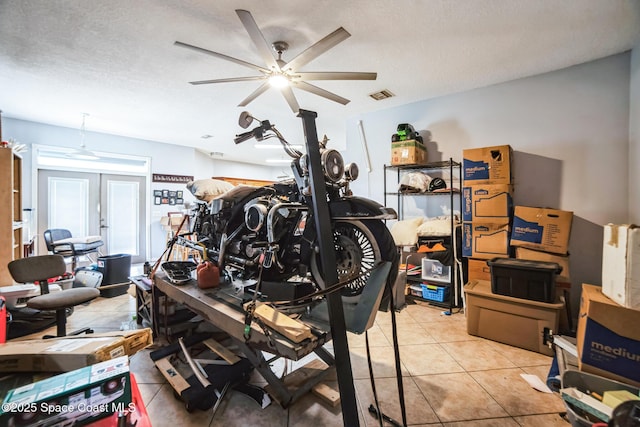 interior space featuring ceiling fan and french doors