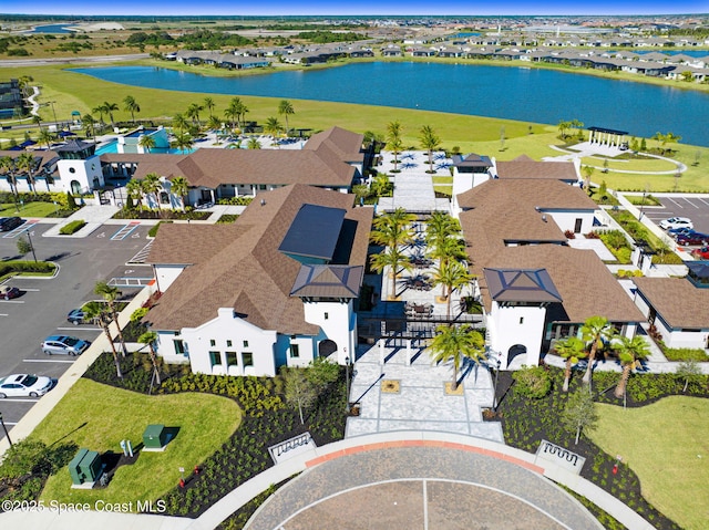 birds eye view of property featuring a water view