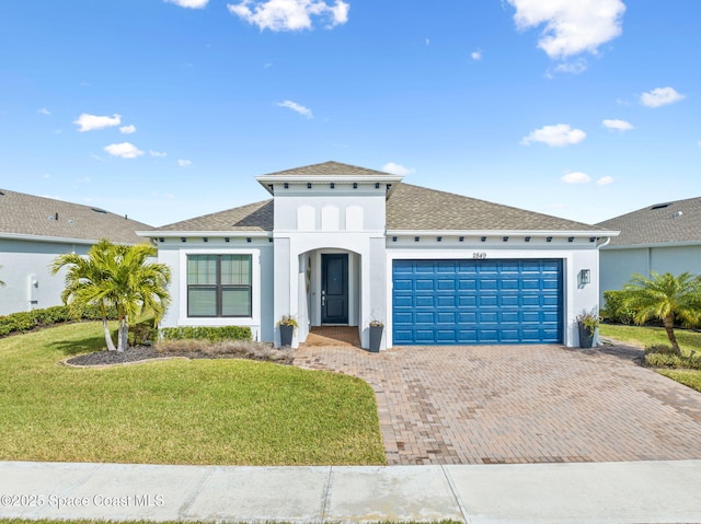 2849 Millennium Cir, Melbourne, FL 32940 - mediterranean / spanish house with a garage and a front lawn