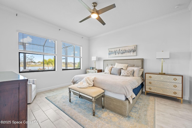 bedroom featuring ceiling fan and crown molding