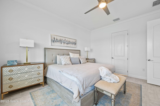 bedroom with ceiling fan and ornamental molding