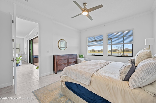 bedroom with light wood-type flooring, ceiling fan, and crown molding