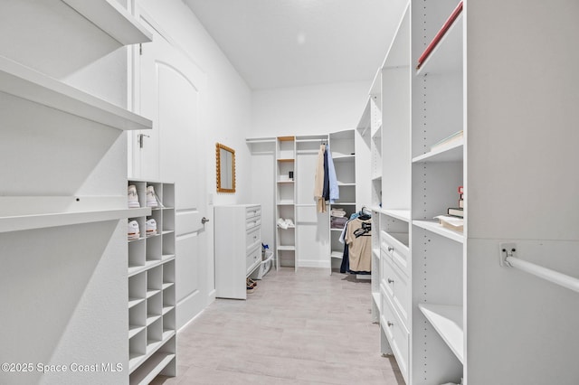 walk in closet featuring light wood-type flooring