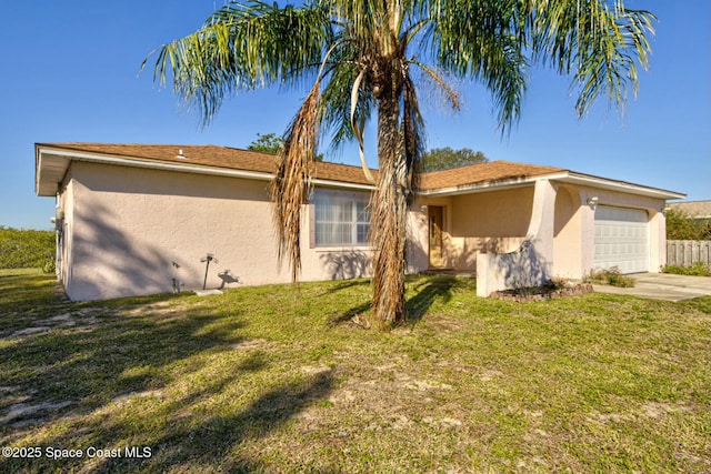 view of front of home with a garage and a front lawn