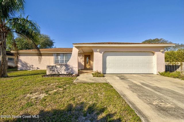 ranch-style home with a front yard and a garage