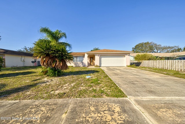 view of front facade featuring a front yard and a garage