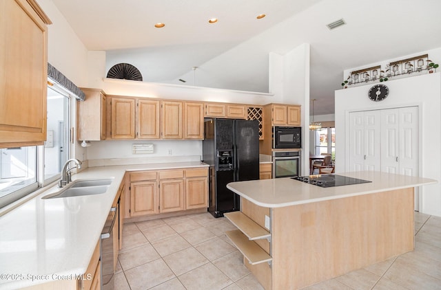 kitchen with black appliances, a kitchen island, light brown cabinets, sink, and light tile patterned floors