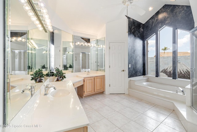 bathroom with ceiling fan, tile patterned flooring, shower with separate bathtub, and vanity