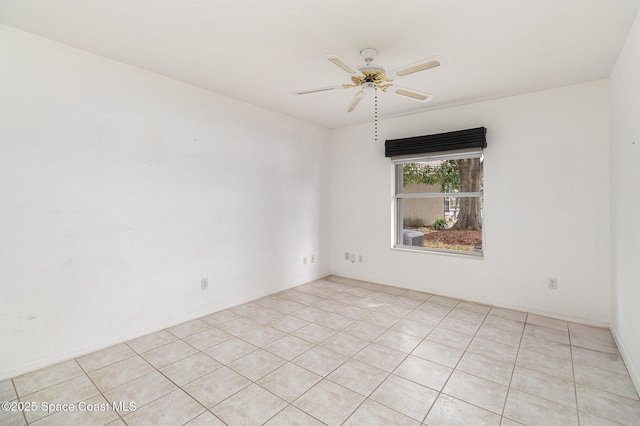 tiled empty room with ceiling fan