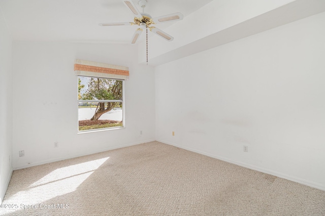 carpeted spare room featuring ceiling fan and high vaulted ceiling