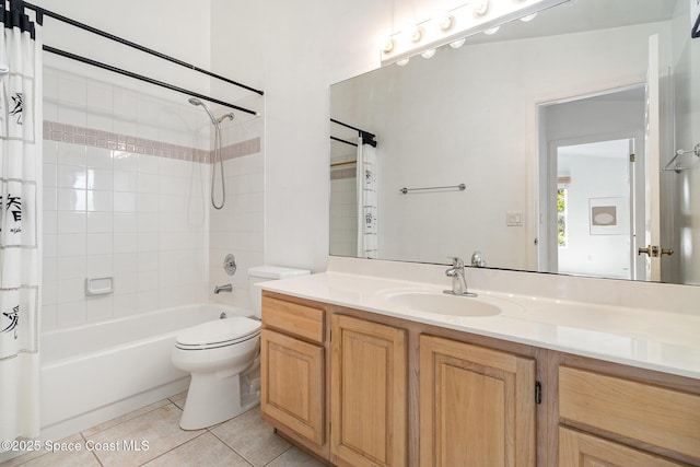 full bathroom featuring toilet, vanity, tile patterned flooring, and shower / tub combo