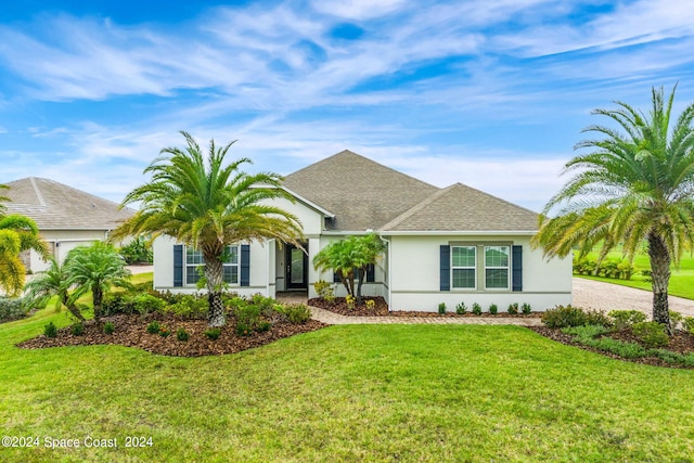 ranch-style house featuring a front lawn