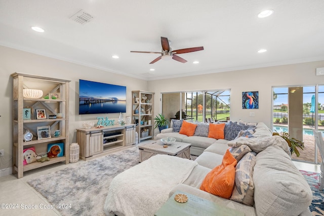 living room featuring ceiling fan and ornamental molding