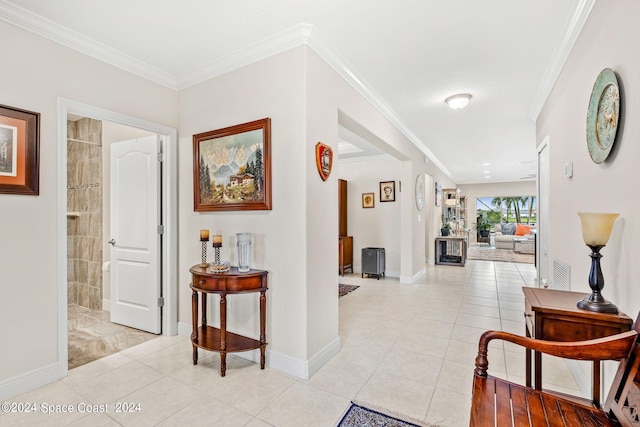 hallway featuring light tile patterned floors and crown molding