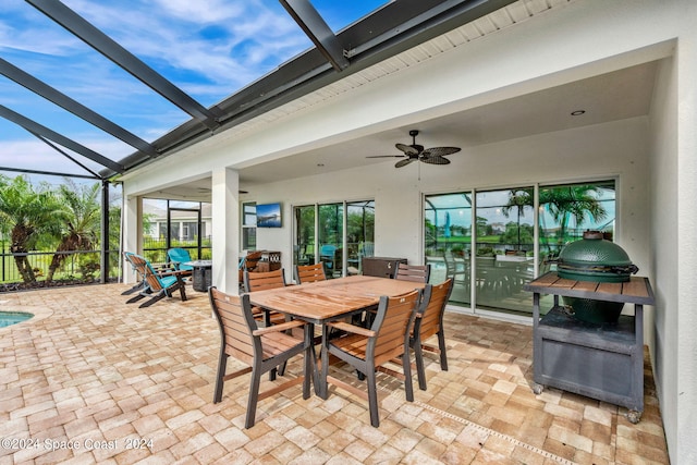 view of patio / terrace with a lanai and ceiling fan