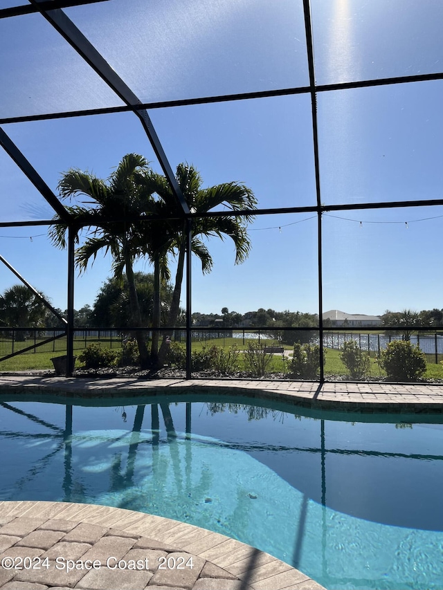 view of pool with a lanai