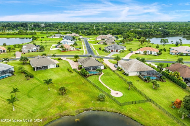 birds eye view of property with a water view